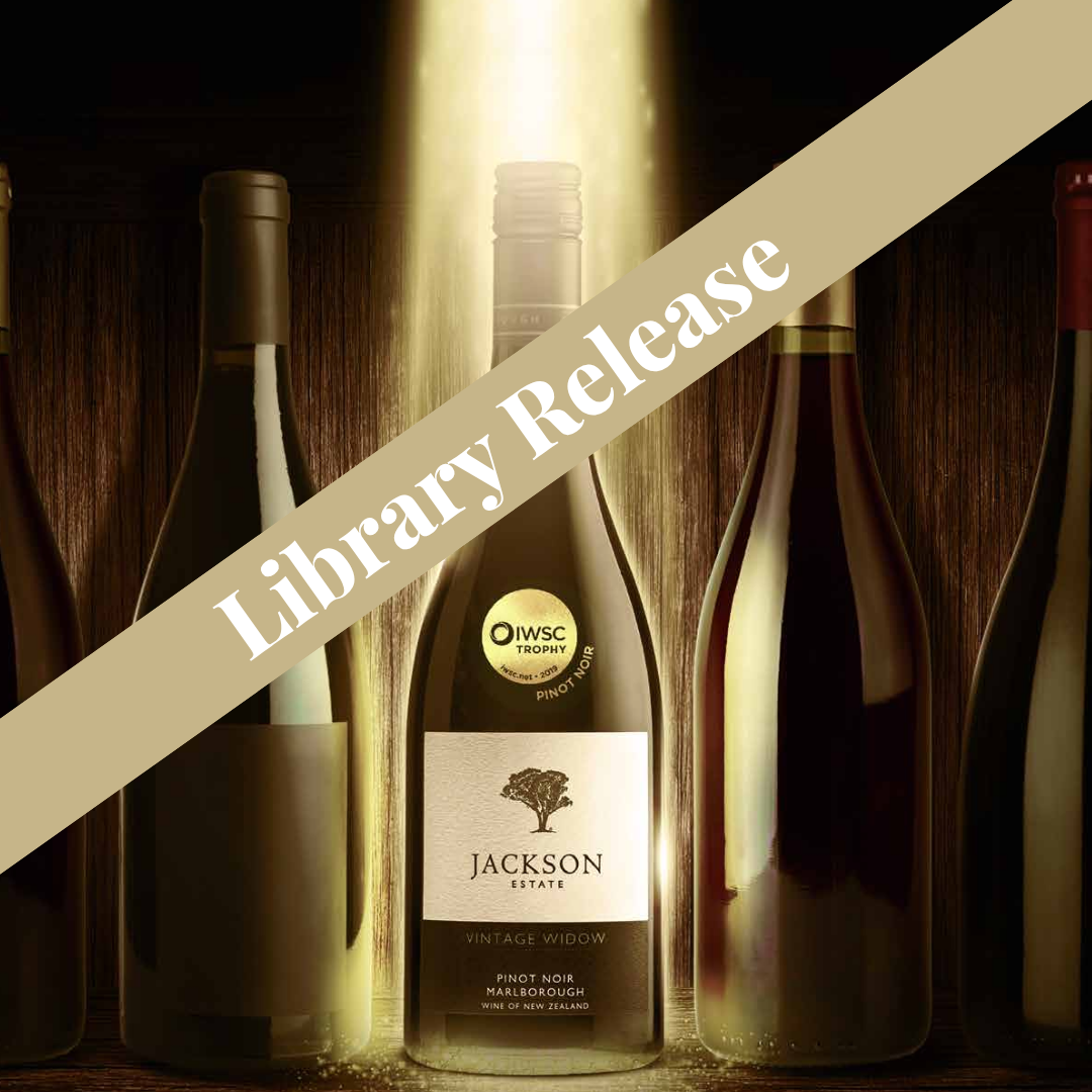 Jackson Estate Vintage Widow Marlborough Pinot Noir bottle with IWSC Trophy medal, surrounded by cellar bottles, Library Release banner overlay